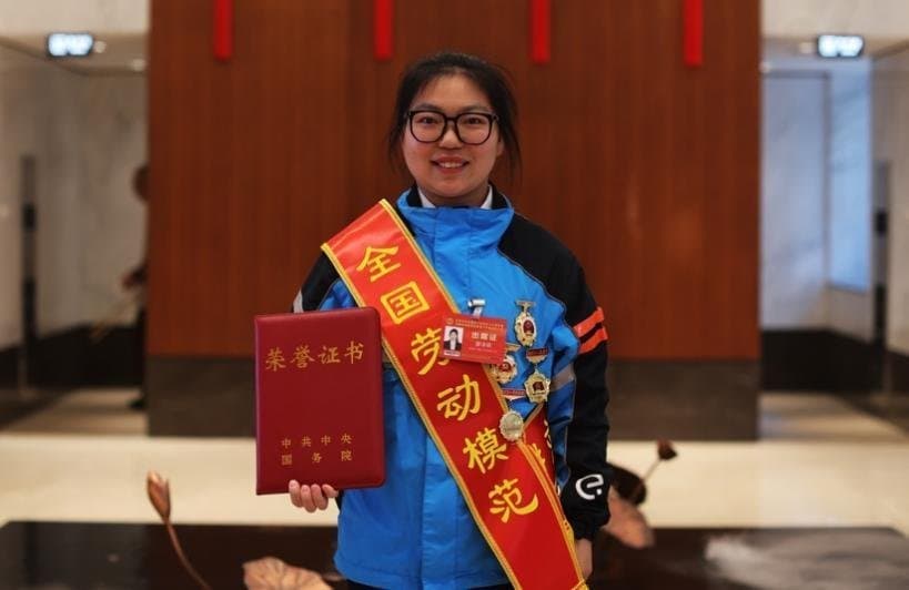 China's Shining Star: Female Delivery Rider Honored as National Labor Model