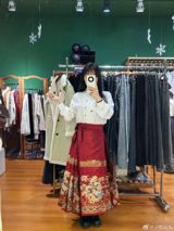 In the quaint town of Haining, Zhejiang Province, China, a traditional Chinese dress known as the "maface skirt" has taken the country by storm. The horse-head shaped opening of the skirt has captured the hearts of Chinese citizens, leading to unprecedented demand and sales soaring. Local manufacturers are struggling to keep up, as the charm of this centuries-old garment has caught the attention of China's modern society. This surge in popularity has not only breathed new life into China's traditional fashion but also sparked an unexpected cultural revival.