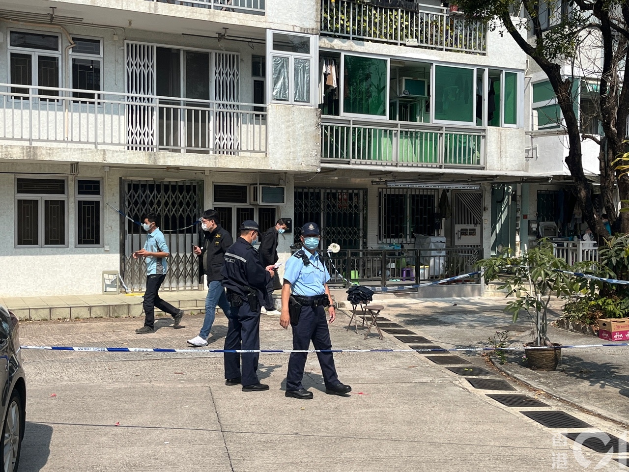 Police officers search the courtyard of the Tai Po village house in the days after Abby Choi's disappearance in February 2023. Photo: HK01