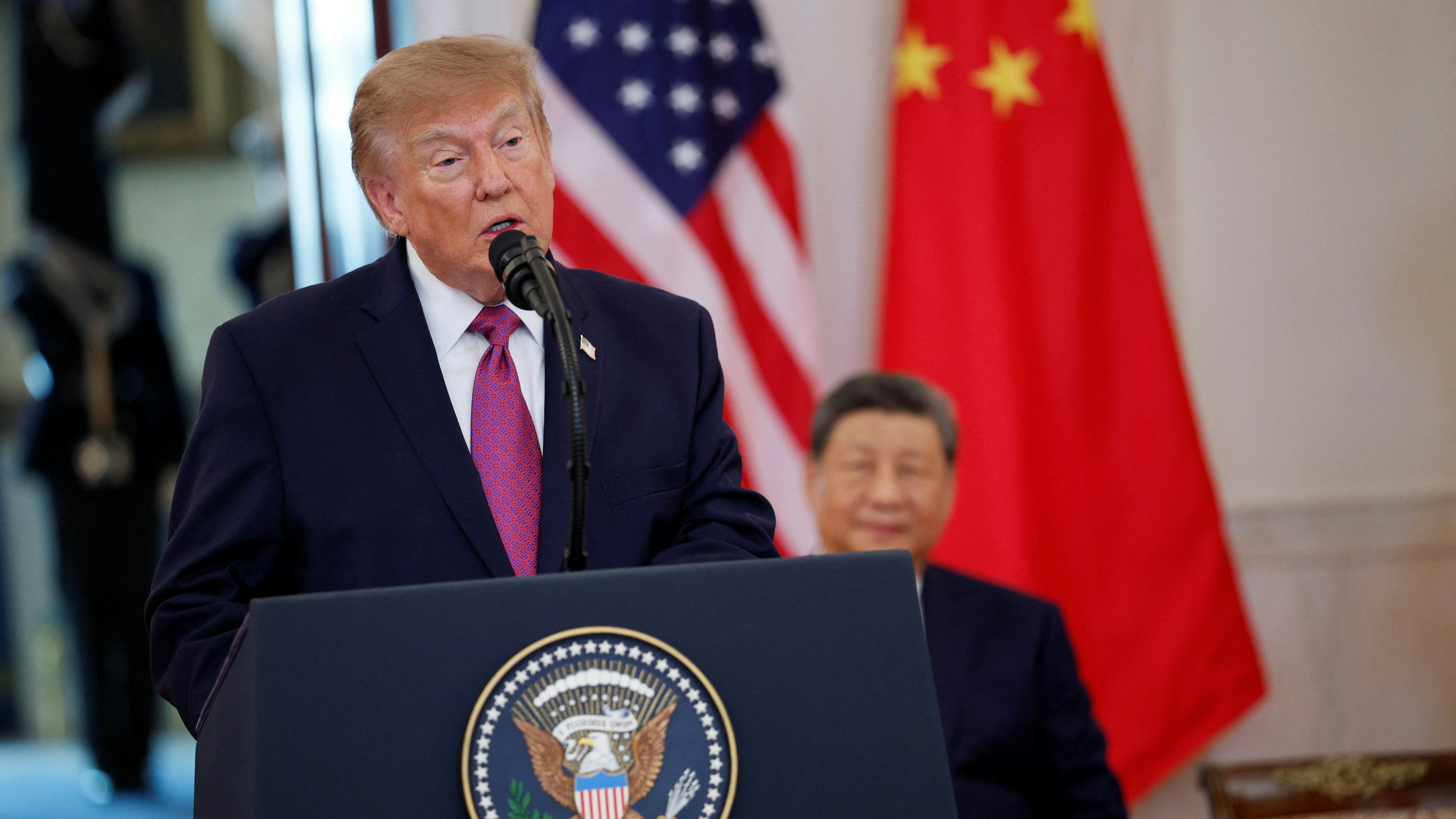 President Trump speaks at the White House podium with Xi Jinping behind him during their September 24 talks. Photo: HK01