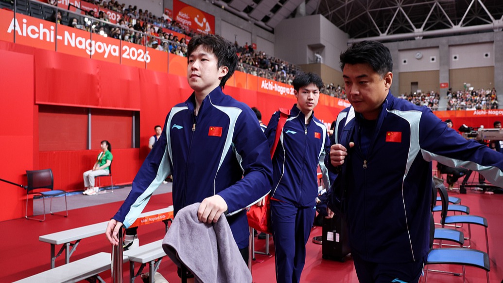 Members of China's men's table tennis squad walk off after the team final at the Aichi-Nagoya Asian Games. Photo: The Paper