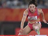 Three years after a false start disqualified her in Hangzhou, Wu Yanni produced the slowest reaction time of the Nagoya final, rebuilt the race from last place over the first hurdle, and took bronze in 13.12 seconds — then cried, gave herself full marks, and became China's sports story of the night.