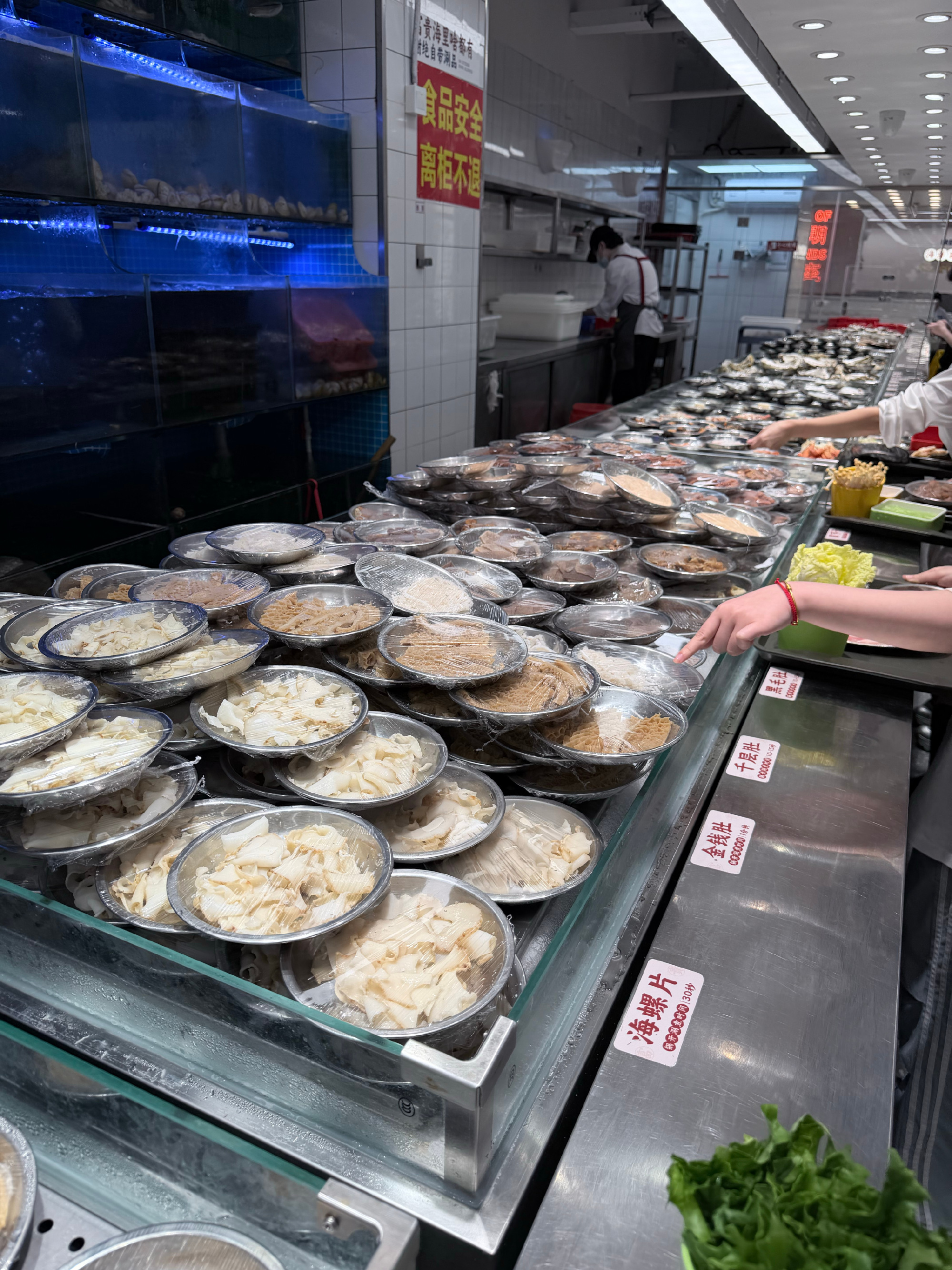 A Fuzhou hotpot brand has become China's quiet restaurant phenomenon by slashing the price of a seafood feast from around 300 yuan to barely 100, using scale, short supply chains, and a one-pot-per-diner format. The line outside its 208-table flagship is now the business story visitors post most.
