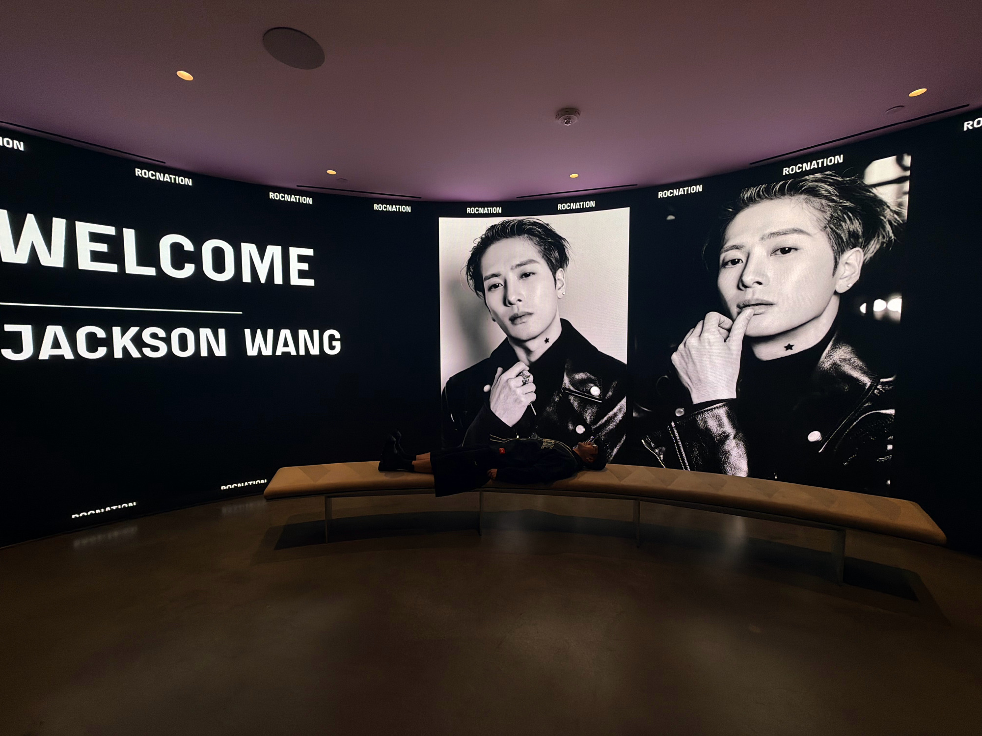 A "Welcome Jackson Wang" display glowing on a curved screen at Roc Nation, from the singer's own announcement post. Photo: @王嘉尔
