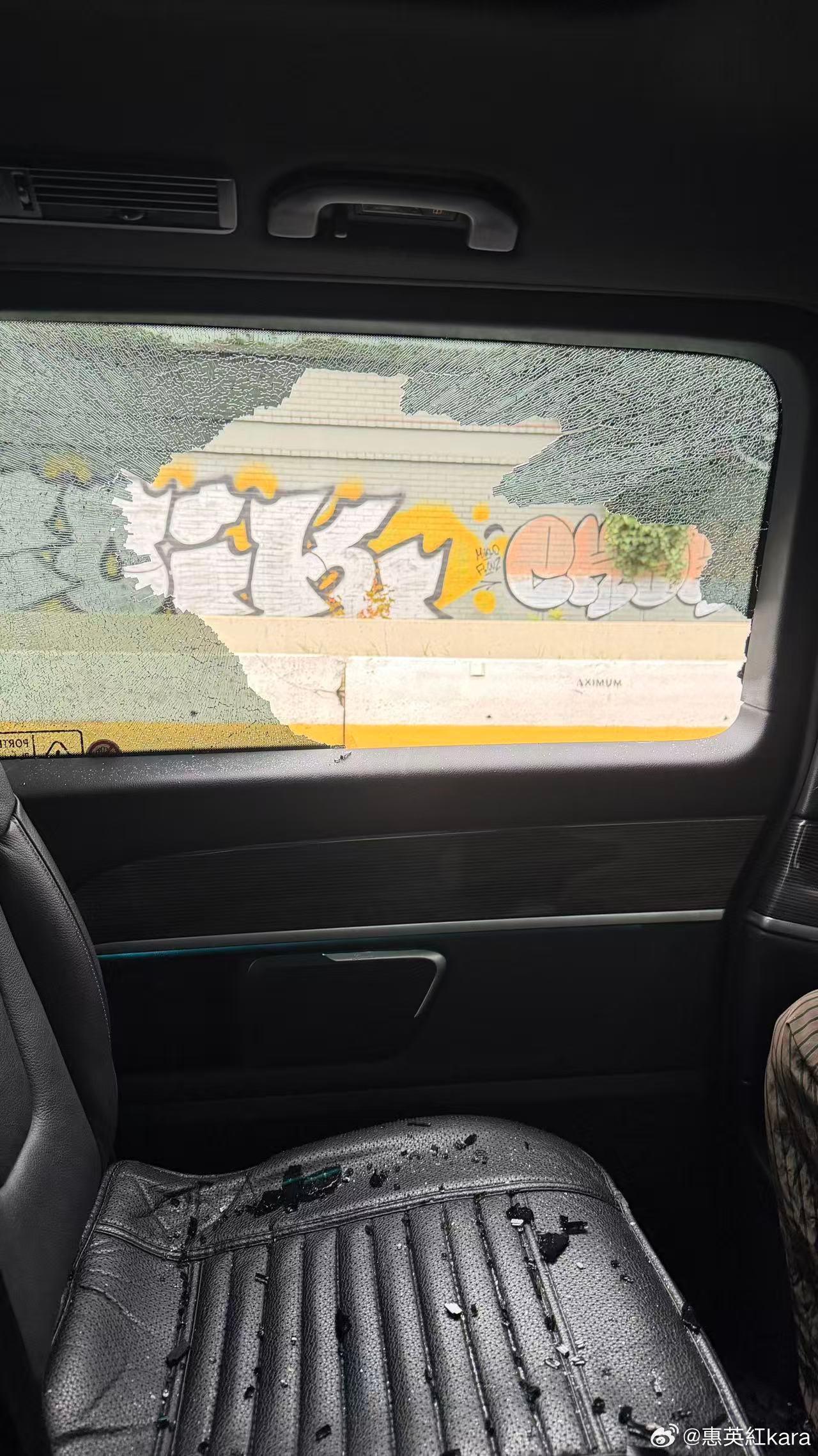 The team's car interior after the smash, with the highway's graffiti wall visible through the broken glass. Photo: @惠英紅kara