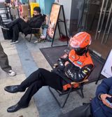 A Weibo user's post comparing her own casual clothes with the crisp outfits of colleagues and delivery riders went viral, churning up a quiet conversation about workplace dress codes, professional 'face', and the uniforms that structure Chinese working life.