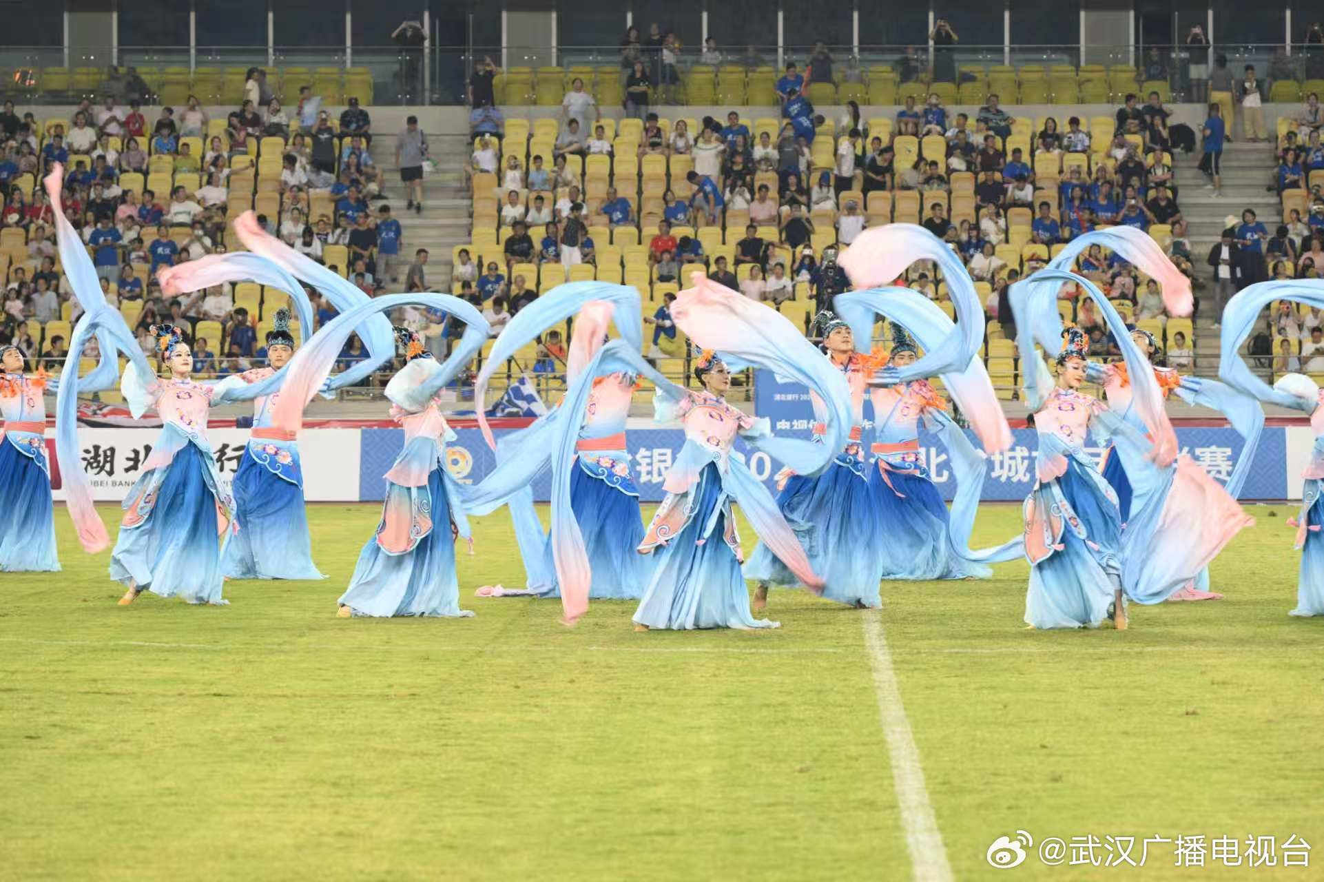 Halftime entertainment at the Wuhan city league ground, in seats that local broadcasters say have filled all season. Photo: @武汉广播电视台