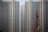 Two weeks after China's housing ministries rewrote the country's sales rules, land auctions in Xiamen, Lishui and Guangzhou already require finished-home sales — the clearest sign yet that the pre-sale model behind China's unfinished-tower disasters is being phased out.